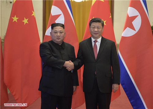 Xi Jinping, Kim Jong Un Hold